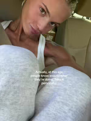 The cover image shows a close-up selfie taken in what appears to be a vehicle. A fair-skinned woman with blonde hair, styled in a bun, is positioned slightly off-center. She is wearing a white tank top and has subtle makeup. The text overlay, written in a clean, sans-serif font, is positioned in the lower center, with the woman just above it. The lighting is soft, and the overall composition is simple yet intimate.
