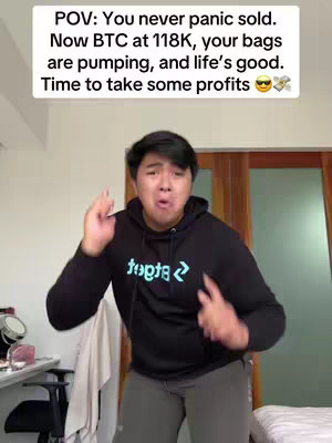 A man in a black hoodie with white text is enthusiastically gesturing in front of a plain background, with text overlayed at the top.