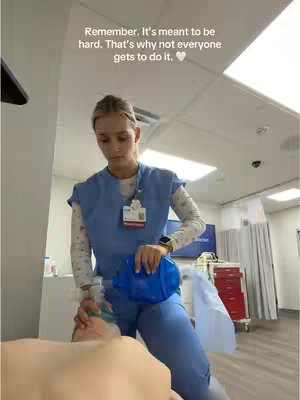 A female healthcare professional wearing scrubs is shown kneeling over a patient in a clinical setting, holding a bag valve mask. Text is overlaid on the image.