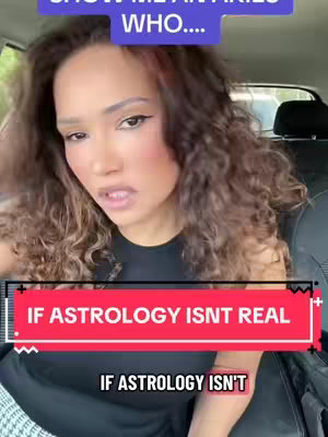 A woman with long curly brown hair in front of what appears to be a car interior. The woman is looking slightly up with a concerned expression. There is a red background behind a black box with the words, “IF ASTROLOGY ISNT REAL” superimposed over her.