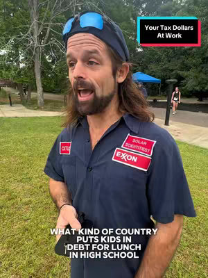 The cover image shows a man with long hair and a beard speaking with an open mouth. He is wearing a dark blue work shirt with patches that say 'SOLAR SCIENTIST' and 'EXON'. Above his head is a blue cap and sunglasses. Below him, on the bottom, it says 'WHAT KIND OF COUNTRY PUTS KIDS IN DEBT FOR LUNCH IN HIGH SCHOOL' and on the top right it says 'Your Tax Dollars At Work'. The background is a green park with trees and a person walking in the distance.