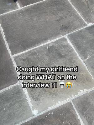 The image shows a close-up of a stone floor or pavement. Overlaid on the image is white stylized text with a question and reaction emojis.