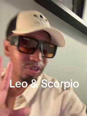 A man wearing a baseball cap, sunglasses, and a light-colored shirt is captured in a medium shot. Text that reads Leo & Scorpio is at the bottom of the frame.