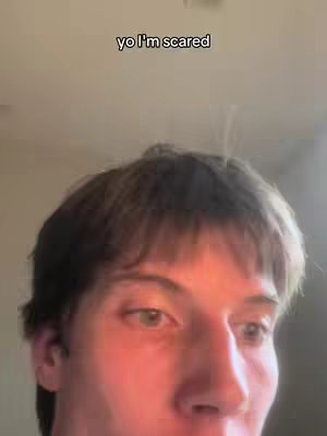 The cover image shows a close-up of a young man's face, slightly angled to the right. He has short, dark hair and is looking towards the camera. A text overlay at the top reads 'yo I'm scared'. The background is out of focus and appears to be an interior scene.