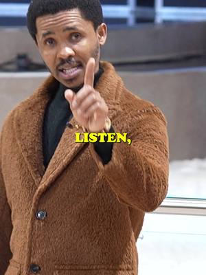 A man in a brown coat points upward with a finger, overlaid with the text "LISTEN," in yellow. The background blurs into a pale, neutral tone.