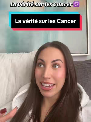A medium shot shows a young woman with long, dark hair and fair skin indoors. She is seated on a couch and speaking directly to the camera with a warm smile. Above her, a sign reads "La vérité sur les Cancer". The background includes a blurred print.