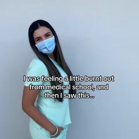 A young woman wearing a medical mask and scrubs stands in front of a plain background. She has long, dark hair and is looking towards the camera with a slight smile. Text overlays the image.