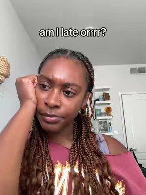 A woman with braided hair is looking off to the side pensively while resting her head on her hand. The text overlay on the cover reads "am I late orrrr?"