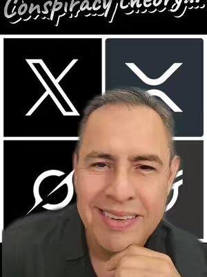 A man is smiling, positioned in front of four black squares arranged in a 2x2 grid. Each square contains a white symbol; the top-left square features the 'X' logo, the top-right square depicts an 'XRP' symbol, and the bottom-left and right squares contain other crypto symbols. The man's face and the logos are the central parts of the visual focus against a black background, with the text 'Conspiracy Theory' appearing above.