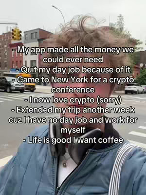 A selfie-style shot of a young man standing on a city street, with text overlayed. He's wearing a blue jacket, and headphones are around his neck. Behind him is a city scene with buildings, traffic lights and cars.