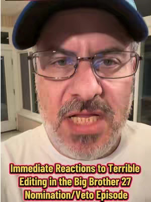 A close-up shot of a man's face, wearing glasses and a baseball cap. He is looking directly at the camera with a slightly distressed expression. Overlayed on the bottom of the image is a yellow band with text.