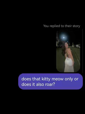 The cover image is a vertical frame. On the right half, a woman in a white dress is seen walking away from the camera, outdoors in the night, with streetlights in the background. The main element in the foreground is a speech bubble, which has rounded corners and a purple fill, and text in a white san-serif font. The text asks, "does that kitty meow only or does it also roar?"