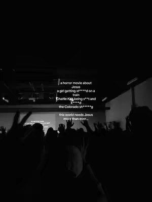 The cover image is a black and white photo of a large crowd of people with their hands raised. There is text overlayed on the image.