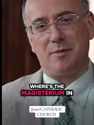 The cover image features a close-up of a man wearing glasses and a suit jacket over a striped shirt. He is positioned in the upper portion of the frame, with text overlaid at the bottom. The background is blurred, and the overall color scheme is muted with natural lighting.
