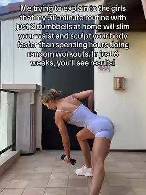 A woman in a light blue athletic outfit is bent over, holding a dumbbell in one hand. She appears to be outdoors on a balcony or patio.