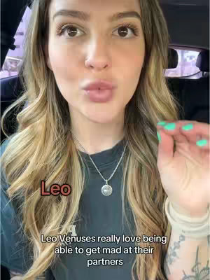 The cover image features a woman centered in a selfie-style shot. She has long, wavy blonde hair, and a silver necklace. The text 'Leo' is overlaid in a brown box in the lower left corner of the image. Below it is the text overlay: 'Leo Venuses really love being able to get mad at their partners.' The background is blurred, suggesting a car interior or similar environment.