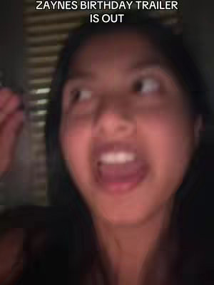 A blurry, close-up shot of a young woman with dark hair, her face illuminated. Her eyes are wide and looking up to the left. Her mouth is open in an expression of excitement. Overlayed at the top is text.