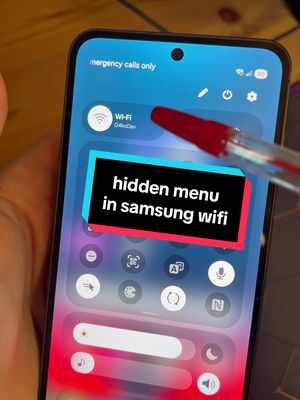 A smartphone screen is shown, displaying the settings menu. Overlaid on the screen is a black shape with the text 'hidden menu in samsung wifi'. A red pen is pointing at the screen.