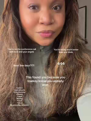 The cover image is a selfie-style close-up of a person with long, wavy brown hair, a light complexion, and a nose ring. The person is looking directly at the camera with a neutral expression. Text overlays are scattered across the image, including spiritual messages and lists of words or phrases. The overall color palette is warm with soft lighting.