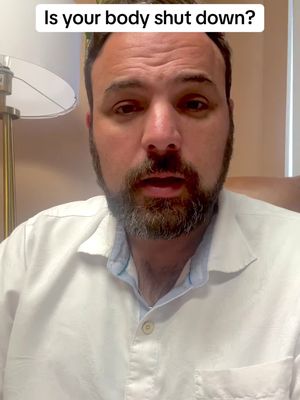 A man with a beard and a white shirt looks directly at the camera. Text overlayed on top of the image.