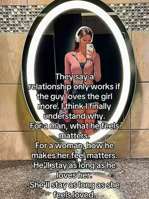 A woman is reflected in a large, round mirror. She is wearing a pink zip-up jacket, has headphones on, and is holding a phone up to take a selfie. Text is overlaid on the image and appears in white font, discussing relationship dynamics.