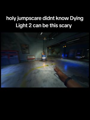 The image showcases a first-person view from a video game, with a hand reaching forward. The scene is set in a dimly lit room with concrete floors and blue and yellow lighting accents. Text overlay at the top reads, 'holy jumpscare didnt know Dying Light 2 can be this scary'.