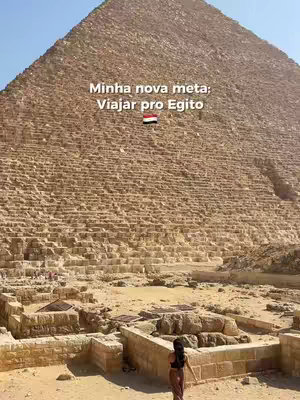 The cover image showcases a woman standing in front of the Great Pyramid of Giza under a clear blue sky. The pyramid dominates the background, its size emphasizing the vast desert landscape. Text is overlaid on the image, and the composition is a combination of natural elements and human presence.