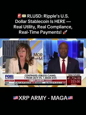The image is a split-screen capture from what appears to be a news broadcast. On the left, a woman with glasses and blonde hair is speaking, with a 'FOX Business' logo visible. On the right, a man in a suit. Below them are stock market indicators and text. The text overlay includes 'RLUSD: Ripple's U.S. Dollar Stablecoin Is HERE', along with other related descriptions.