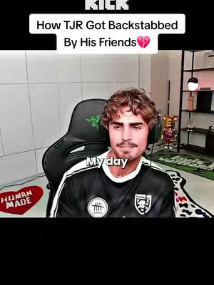 A man with curly hair looks towards the camera, sitting in a gaming chair. Text overlays include the video title and the words 'My day'. The background has a blurred out appearance.