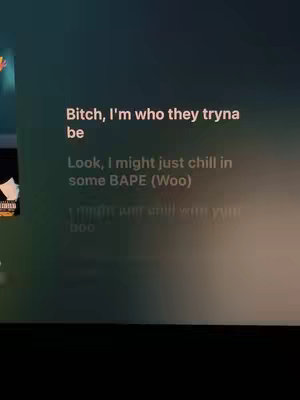 The cover image displays text overlayed on a blurred background, with partial visibility of what appears to be a display on the left side. The overlay consists of song lyrics in a white sans-serif font.