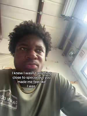 A medium shot shows a young Black man facing the camera, looking up and to the side with a thoughtful expression. He has a curly afro and is wearing a green shirt with a gold chain. Text is overlaid on the image.