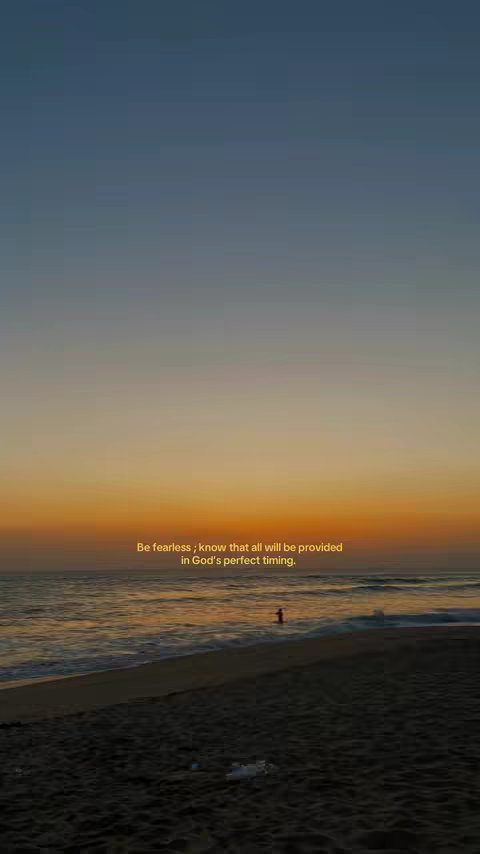 The image shows a beach at sunset. The sky transitions from a dark blue at the top to an orange and yellow horizon. The ocean is calm, with a silhouette of a person standing in the water. The beach is dark, and the overall scene has a peaceful, serene atmosphere. Text overlayed on the image that looks like a hook, but the image may have been generated with the quote.