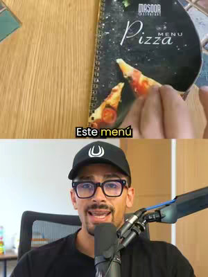 The image is divided into two halves. The top shows a pizza menu partially opened, with a slice of pizza being picked up. The menu cover is black with the word 'Pizza' in white against a background of what seems to be a table or wooden surface. The bottom half displays a man wearing glasses, a black cap with a logo and a black t-shirt, talking into a microphone. The colors are neutral, with a focus on the menu and the man's face. The lighting is from the front, illuminating both the menu and the speaker.