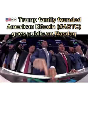 The image shows a group of men in suits celebrating, presumably on a trading floor. Text at the top indicates the Trump family's bitcoin venture going public, with an American flag and eye emojis enhancing the message.