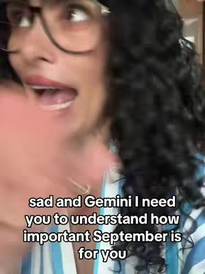 A close-up shot of a person with curly hair and glasses, wearing a blue and white striped shirt. The person has an open mouth, as if speaking with text overlayed on the image.