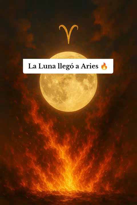 The image is a digital illustration with warm, fiery colors. The central element is a large, full moon, depicted in glowing shades of yellow. Above the moon, there’s a golden Aries symbol. Below the moon, a vibrant, orange flame-like pattern fills the lower half of the image. The hook text overlaid on a white rectangle in front of the moon, reads "La Luna llegó a Aries", with a fire emoji beside it, and the background of the image is dark