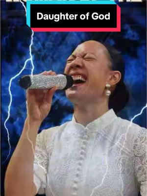 The image showcases a woman with dark hair, wearing a white top, and holding a microphone. She appears to be singing or speaking with great emotion, her mouth wide open and eyes squeezed shut. The background has a stylized, blue and white lightning effect. Overlayed on top is a rectangular bar with text in bold white that reads 'Daughter of God' .