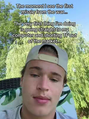A young man in a light green cap is sitting on a chair outside with trees in the background. Text overlays on the image.