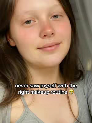 The cover image features a close-up of a person's face. The person has light skin, brown hair, and is looking slightly to the side with a soft smile. Text is overlaid at the bottom of the image.