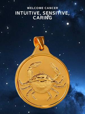 The image features a gold pendant with the Cancer zodiac symbol. It is set against a background of a dark blue gradient that simulates a starry night. White text at the top, "WELCOME CANCER INUITIVE, SENSITIVE, CARING", is over the pendant with stars in the background. The pendant is circular with a ring at the top; it has a detailed crab design, its claws extended outward.