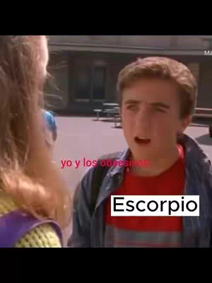 The cover image is a screen grab from what appears to be a movie or TV show. It shows a fair-skinned young man with brown hair looking toward the right with an open mouth. To his left, another person is slightly out of frame. Text overlays the image, with 'yo y los obse**' appearing in a white font near the top left, and the word 'Escorpio' inside a white box at the bottom right.