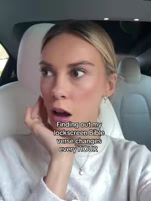 A woman inside what appears to be a car, looking surprised. Overlay text is centered, with text at the bottom.