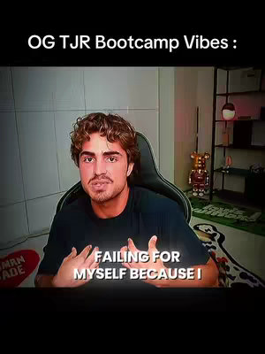 The image shows a man in front of a computer screen. He is wearing a black t-shirt. Text on the screen reads, "FAILING FOR MYSELF BECAUSE I". The background has a soft focus, suggesting an office or home office environment.