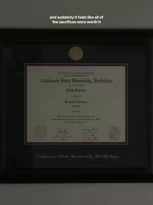 The cover image displays a framed diploma. The top left corner shows text in white. The framed diploma is black, with the diploma inside having a cream color. The frame itself is set against a neutral background, likely a wall. The composition is straightforward, with the diploma centered, and the text at the top.
