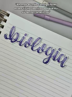 The image shows a notebook page with handwriting in a cursive style. The title 'biologia' is written in dark purple with a white outline in a decorative script. Above the main title, there's a caption in handwritten text in a darker color. The background includes the notebook's pages and two pens.