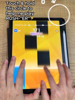 A person's hands are seen using a black tablet, playing a music game. The game interface fills most of the screen, composed of black and yellow tiles. Text overlays explain gameplay mechanics.