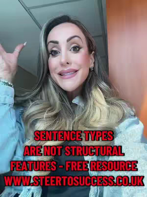 A woman with long blonde hair and makeup smiles at the camera, raising her hand. Text in red is overlaid on the image.
