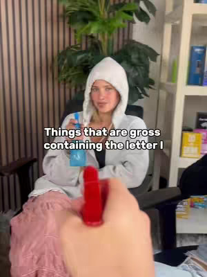 The cover image shows a woman in a white hooded sweatshirt pointing a red spray bottle at the camera against the backdrop of a room with wood paneling. A green plant is in the background, adding a touch of nature.