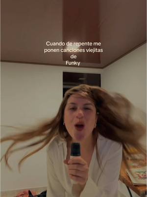 The cover image shows a woman with her hair flying, holding a microphone, with text overlayed on the image.