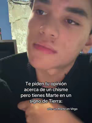 A young man with dark hair and a light complexion gazes slightly upwards and to the left. He wears a casual black shirt. Text overlays the image, providing commentary on astrology.